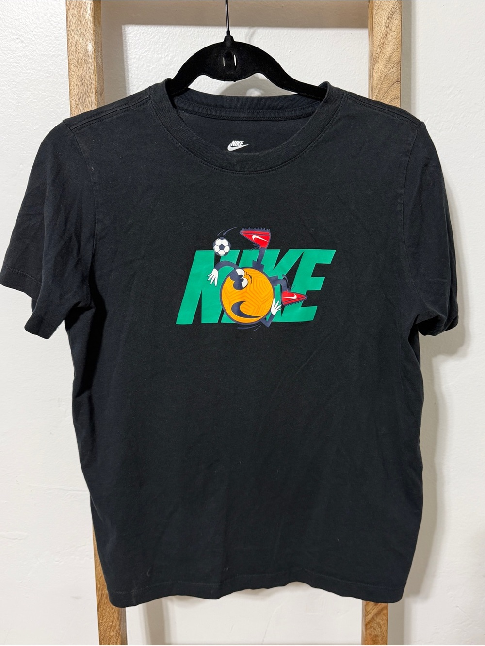 Nike Black Tee with Green Logo and Yellow Emoji Graphic